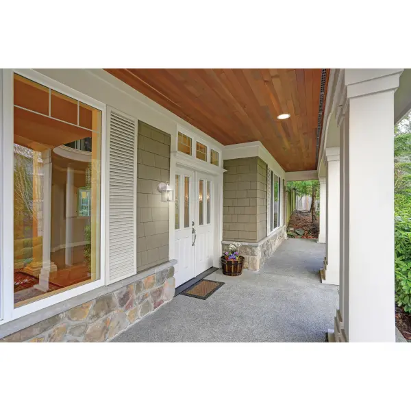 A budget-friendly outdoor wall lantern featuring a timeless cube design with clear beveled glass. The crisp white finish offers versatile styling that complements various exterior aesthetics from traditional to coastal homes. - alternate view