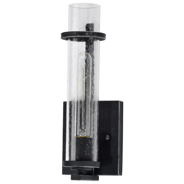 The Donzi vanity light blends antique character with modern simplicity. Its clear seeded glass cylinder and deep Iron Black finish create authentic vintage appeal, especially when paired with Edison bulbs.