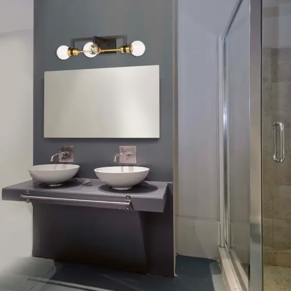 Intention 3-Light Vanity Light in Warm Brass and Black - Image 5