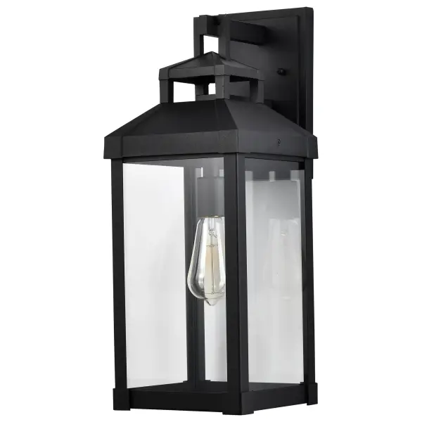 The Corning wall lantern delivers understated elegance with its carriage-inspired design and clear glass panes. The matte black finish provides versatile styling that complements various home exteriors while showcasing vintage bulbs beautifully.