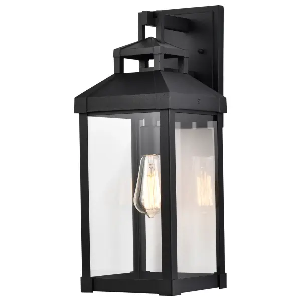The Corning wall lantern delivers understated elegance with its carriage-inspired design and clear glass panes. The matte black finish provides versatile styling that complements various home exteriors while showcasing vintage bulbs beautifully. - alternate view