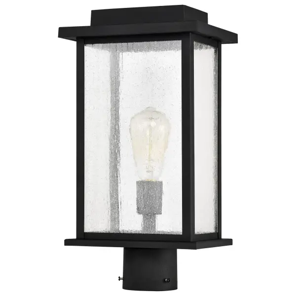 The Sullivan post light delivers no-nonsense styling with a stretched metal frame and clear seeded glass that creates beautiful bands of illumination. Its matte black finish coordinates effortlessly with any home exterior. - alternate view