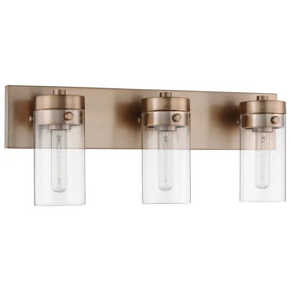 The Intersection vanity fixture blends modern, industrial, and chic design elements with cylindrical clear glass shades that showcase vintage filament bulbs. The rich burnished brass finish adds warmth and pairs beautifully with existing fixtures.