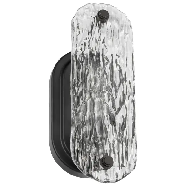 The Glacier vanity sconce combines modern minimalism with dramatic ice glass texture. Its matte black finish and clean lines create a sophisticated look perfect for contemporary bathrooms and powder rooms.