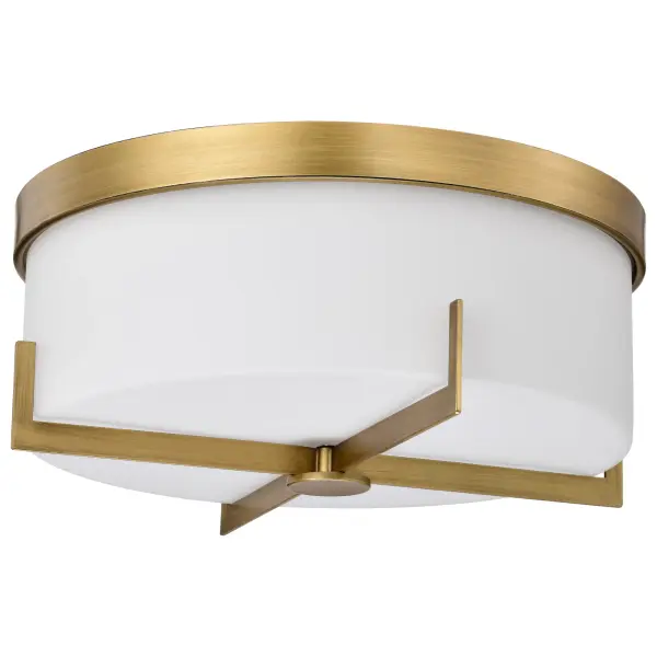 The Roselle flush mount combines timeless brass warmth with contemporary clean lines. Its white glass diffuser provides soft, even illumination perfect for spaces with standard ceiling heights.