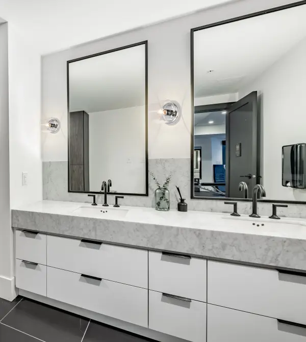 The Marlowe 1-Light Vanity combines contemporary design with timeless elegance. Its horizontal clear glass cylinder and polished nickel finish create a warm, inviting glow perfect for modern bathrooms and powder rooms. - alternate view