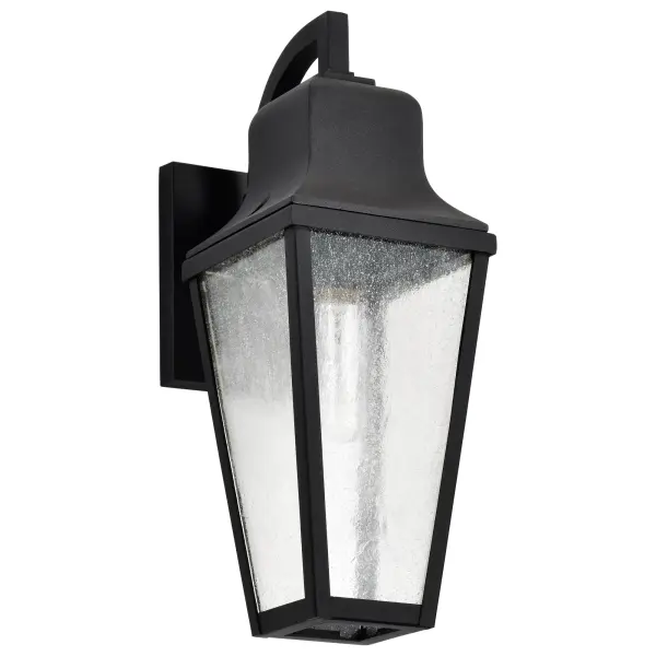 The Lawrence wall lantern combines classic English bobby-inspired design with modern versatility. Its matte black finish and clear seeded glass create warm, welcoming illumination perfect for any outdoor setting.