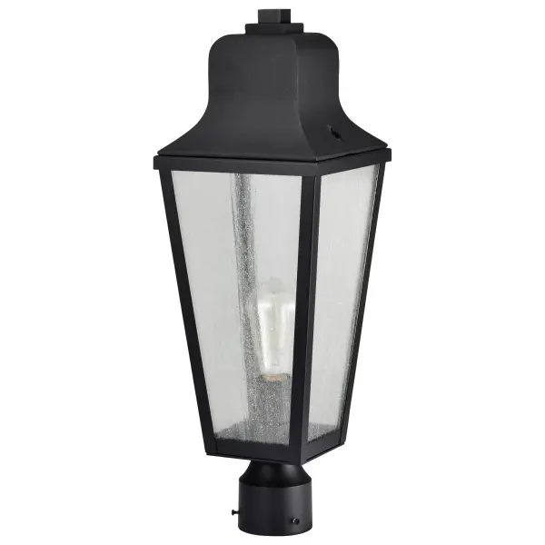 The Lawrence post lantern combines traditional English design with modern versatility. Its matte black finish and clear seeded glass create a warm, welcoming glow perfect for both urban and countryside settings.