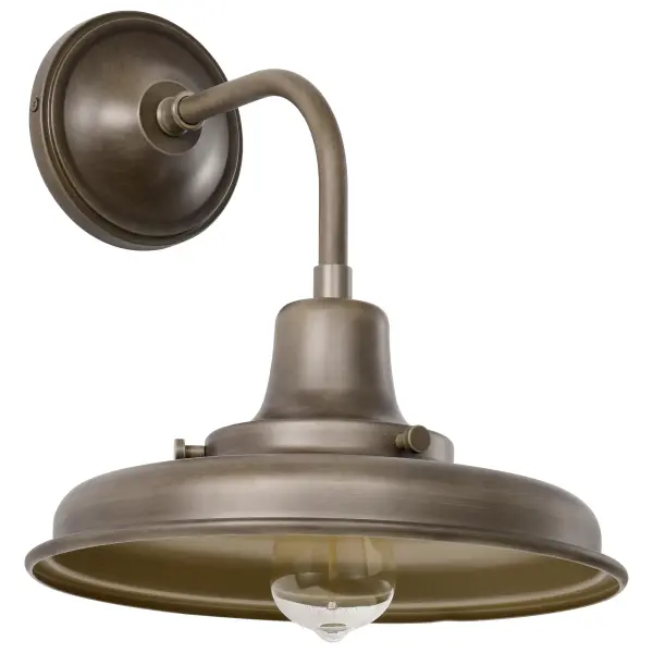 The Morris Medium Outdoor Lantern combines classic barn light design with industrial accents, creating an inviting farmhouse aesthetic. The burnished bronze finish adds warmth and vintage appeal, perfect for porches, patios, and entryways.