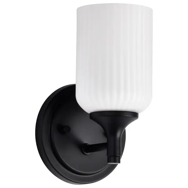 The Solara wall sconce combines traditional elegance with contemporary simplicity. Its matte black finish and frosted ribbed glass create a soft, inviting glow perfect for bathrooms, hallways, and bedrooms.