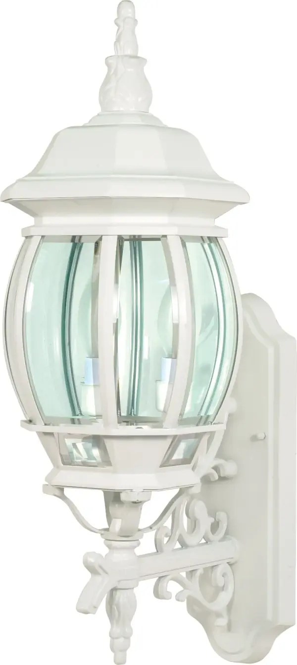 The Central Park wall lantern combines classic design with practical outdoor lighting. Its white finish and clear beveled glass create a sophisticated look that complements traditional and transitional home exteriors.