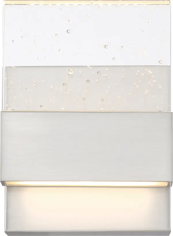 This compact LED wall sconce combines contemporary styling with practical illumination. The polished nickel finish and seeded glass create visual interest while delivering 675 lumens of warm 3000K light for 30,000 hours.