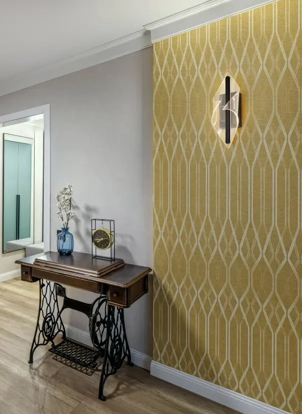 The Geneva wall sconce combines contemporary aesthetics with innovative edge-lit LED technology. Its matte black finish and textured acrylic lens create a sophisticated, even glow perfect for modern bathrooms and hallways. - alternate view
