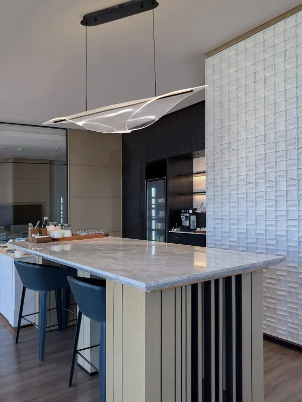 The Geneva 46" Island Pendant combines bold matte black styling with innovative edge-lit LED technology and silk screened acrylic panels. Perfect for modern kitchens and dining spaces seeking dramatic visual impact with efficient, even illumination. - alternate view