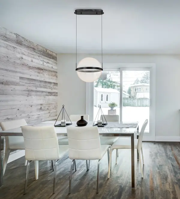 The Arvada pendant combines sleek modern design with integrated LED efficiency. Its 16-inch silk screened acrylic sphere creates intricate light patterns while the matte black finish adds contemporary sophistication to any space. - alternate view