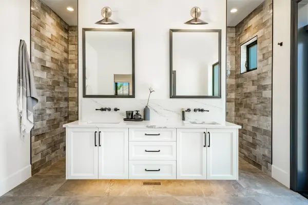 The Corrine LED wall sconce combines minimalist design with practical functionality. Its integrated LED offers three selectable color temperatures (3K/4K/5K) for customizable ambiance, while the burnished brass finish adds warmth to modern spaces. - alternate view