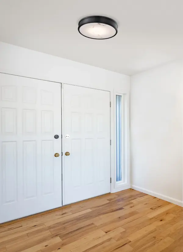 The Kendall flush mount combines transitional elegance with modern LED technology, featuring three selectable color temperatures and energy-efficient performance. Its matte black finish and alabaster glass create a sophisticated look. - alternate view