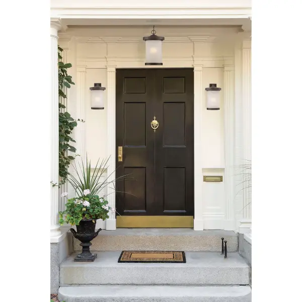 The Diego outdoor pendant combines classic bronze finish with warm satin amber glass, creating an inviting ambiance for covered outdoor areas. LED technology provides energy-efficient illumination with a warm 2700K color temperature. - alternate view