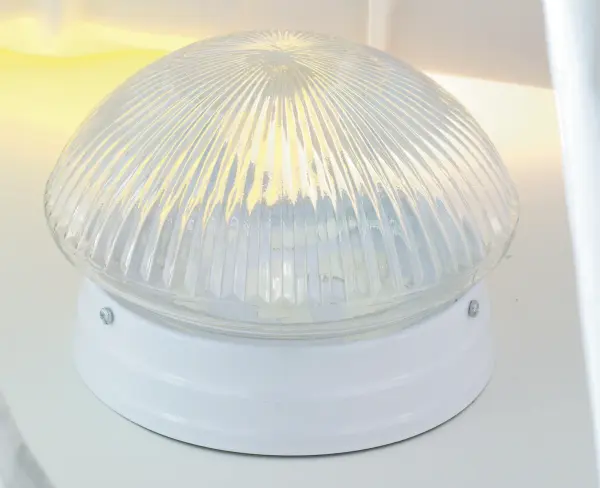 This traditional 2-light flush mount combines elegant ribbed glass with a clean white finish, making it a versatile choice for hallways, bedrooms, and smaller spaces. The mushroom-shaped design adds subtle character.