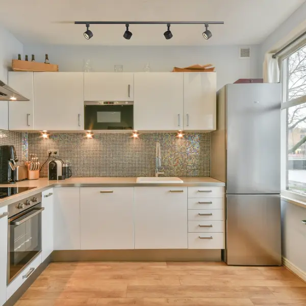 This compact round track head delivers efficient 12W LED lighting with a narrow 24-degree beam angle, perfect for highlighting artwork, architectural features, or task areas. The matte black finish offers timeless appeal. - alternate view