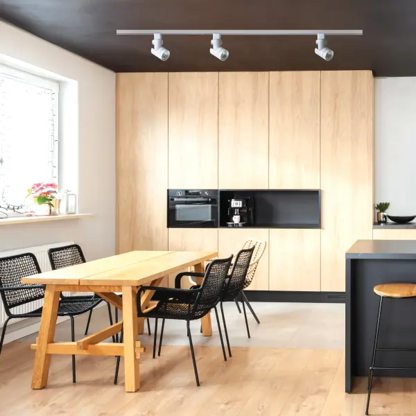 This 12W LED track head delivers focused warm white illumination with a narrow 24-degree beam spread, perfect for highlighting artwork, architectural features, or retail displays. The sleek barrel design in white finish complements contemporary interiors. - alternate view