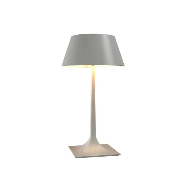 The Nostalgia table lamp brings organic modern elegance with its sculptural white ceramic form. At nearly 30 inches tall, it makes a bold statement while maintaining a soft, approachable aesthetic perfect for contemporary interiors.