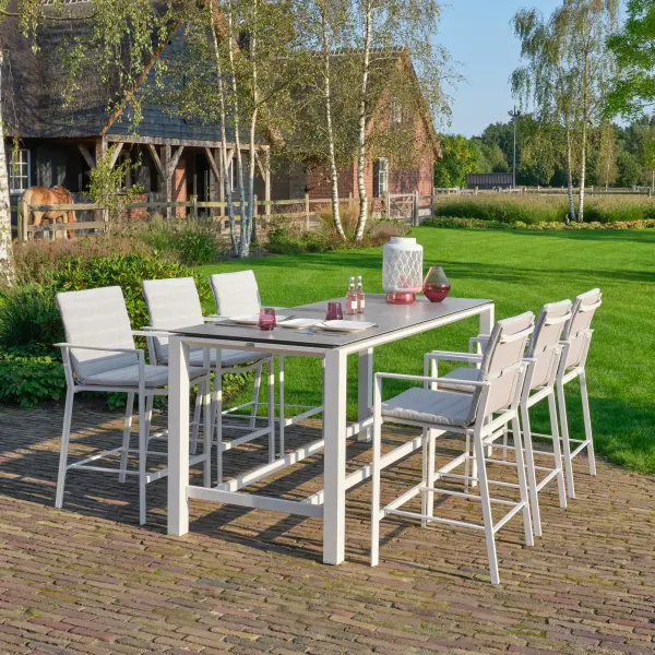 This elegant bar height dining set combines a sleek 83-inch ceramic-top table with six comfortable sling bar chairs. Built with powder-coated aluminum and stainless steel hardware, it's designed for year-round outdoor use with weather-resistant construction and quick-drying fabrics. - alternate view
