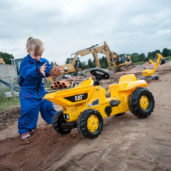 German-engineered pedal tractor with working front bucket, turntable steering, and expandable hitch system. Built for ages 3-6 with 50 lb capacity and high-impact resin construction for lasting outdoor adventures. - alternate view