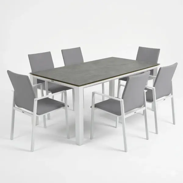 Dine alfresco in style with the Sense Dining Set. The sleek profile of the table and chairs give a clean, contemporary look. The dining chairs feature an aluminum frame with ergonomic arm rests and a comfortable all-weather sling with quick dry foam filling and all weather upholstery fabric. The ceramic top, aluminum frame table is sturdy and weather resistant, ensuring years of outdoor dining enjoyment. Set Includes: (6) Sense Dining Arm Chair (1) 71” x 36” Concept Dining Table Sense Dining Chair Features: Light-weight powder coated aluminum construction All weather soft touch Textilene fabric cushion for optimal weather resistance and color fastness Padded seat-buckets for maximum comfort and support Durable, all-weather frame and fabric construction Protective, replaceable foot caps prevent marring on any surface and extends the life of the chair No assembly needed Stackable for compact, easy storage Frame color: White Measures: 23"W x 23"D x 34"H, 10lbs Fabric Color: Mouse Grey 71" x 36" Ceramic Dining Table Features: Sturdy powder coated aluminum construction with stainless steel hardware Maintenance free ceramic table top is highly scratch resistant and withstand temperatures ranging from -40°F to 500°F Durable, all-weather frame construction Protective, replaceable foot glides prevent marring on any surface and prolong the life of the table Elegant style lines provide a modern look to any outdoor space Reinforced square frame tubing for added strength Integrated foot levelers prevent wobbling on uneven floors No umbrella hole Minimal assembly needed Measures: 71"L x 36"W x 30"H Frame color: White - alternate view