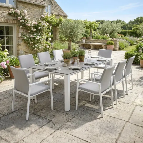 Dine alfresco in style with the Sense Dining Set. The sleek profile of the table and chairs gives a clean, contemporary look. The dining chairs feature an aluminum frame with ergonomic arm rests and a comfortable all-weather sling with quick-dry foam filling and all-weather upholstery fabric. The ceramic top, aluminum frame table is sturdy and weather-resistant, ensuring years of outdoor dining enjoyment. Set Includes: (8) Sense Dining Arm Chair (1) 83” x 36” Concept Dining Table Sense Dining Chair Features: Light-weight powder-coated aluminum construction All-weather soft-touch Textilene fabric cushion for optimal weather resistance and color fastness Padded seat-buckets for maximum comfort and support Durable, all-weather frame and fabric construction Protective, replaceable foot caps prevent marring on any surface and extend the life of the chair No assembly needed Stackable for compact, easy storage Frame color: White Measures: 23"W x 23"D x 34"H, 10lbs Fabric Color: Mouse Grey 83" x 36" Ceramic Dining Table Features: Sturdy powder-coated aluminum construction with stainless steel hardware Maintenance-free ceramic table top is highly scratch-resistant and withstands temperatures ranging from -40°F to 500°F Durable, all-weather frame construction Protective, replaceable foot glides prevent marring on any surface and prolong the life of the table Elegant style lines provide a modern look to any outdoor space Reinforced square frame tubing for added strength Integrated foot levelers prevent wobbling on uneven floors No umbrella hole Minimal assembly needed Measures: 83"L x 36"W x 30"H Frame color: White