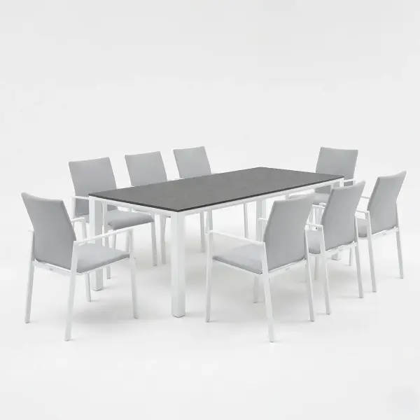 Dine alfresco in style with the Sense Dining Set. The sleek profile of the table and chairs gives a clean, contemporary look. The dining chairs feature an aluminum frame with ergonomic arm rests and a comfortable all-weather sling with quick-dry foam filling and all-weather upholstery fabric. The ceramic top, aluminum frame table is sturdy and weather-resistant, ensuring years of outdoor dining enjoyment. Set Includes: (8) Sense Dining Arm Chair (1) 83” x 36” Concept Dining Table Sense Dining Chair Features: Light-weight powder-coated aluminum construction All-weather soft-touch Textilene fabric cushion for optimal weather resistance and color fastness Padded seat-buckets for maximum comfort and support Durable, all-weather frame and fabric construction Protective, replaceable foot caps prevent marring on any surface and extend the life of the chair No assembly needed Stackable for compact, easy storage Frame color: White Measures: 23"W x 23"D x 34"H, 10lbs Fabric Color: Mouse Grey 83" x 36" Ceramic Dining Table Features: Sturdy powder-coated aluminum construction with stainless steel hardware Maintenance-free ceramic table top is highly scratch-resistant and withstands temperatures ranging from -40°F to 500°F Durable, all-weather frame construction Protective, replaceable foot glides prevent marring on any surface and prolong the life of the table Elegant style lines provide a modern look to any outdoor space Reinforced square frame tubing for added strength Integrated foot levelers prevent wobbling on uneven floors No umbrella hole Minimal assembly needed Measures: 83"L x 36"W x 30"H Frame color: White - alternate view