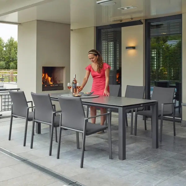 The Sense 7-Piece Dining Set combines sleek contemporary design with commercial-grade durability. Features powder-coated aluminum frames, scratch-resistant ceramic table top, and quick-dry sling chairs with ergonomic comfort. - alternate view