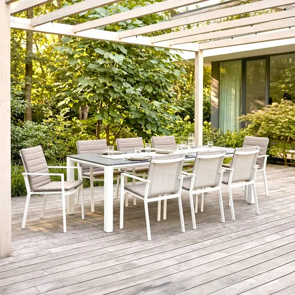Elevate outdoor dining with the Primavera 9-Piece Dining Set, where refined design meets effortless durability. Eight ergonomically contoured sling chairs—crafted with lightweight, powder-coated aluminum frames and breathable, quick-drying acrylic Textilene—offer exceptional comfort, resilience, and stackable convenience, with optional Sunbrella cushions for an added layer of luxury. Paired with the Concept Dining Table, featuring a sleek ceramic top with a sophisticated concrete-look finish, this set delivers both modern elegance and remarkable performance in any climate. In a timeless white and mouse gray palette, Primavera creates a polished, inviting setting for everyday dining and elevated outdoor entertaining. Chair Features: Light-weight powder-coated aluminum construction with stainless steel hardware 100% Acrylic Textilene fabric sling for optimal weather resistance and color fastness Premium, quick-drying sling allows superior drainage Contoured seat and back for maximum comfort and support Frame features full circumference welds for added strength Durable, all-weather frame and fabric construction Integrated arm rests for additional comfort and style Protective, replaceable foot caps prevent marring on any surface and extend the life of the chair Stackable for compact, easy storage Frame | Sling Color: White/Mouse Gray Optional Sunbrella Cushion available in Grey Chine Fabric Table Features: Elegant style lines provide a modern look to any outdoor space Robust powder coated aluminum construction with stainless steel hardware Frame features full circumference welds for a durable, all-weather frame Durable ceramic top with concrete look finish can withstand temperatures ranging from -40°F to 500°F Durable, all-weather frame construction Protective, replaceable foot glides prevent marring on any surface and prolong the life of the table Integrated foot levelers prevent wobbling on uneven floors No umbrella hole Frame Color: White Top Color: Concrete Look - alternate view