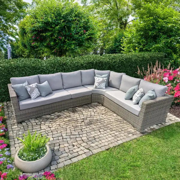 The Aya Wicker Corner Sectional combines durability with coastal elegance. Hand-woven synthetic wicker over aluminum frames provides weather resistance, while plush cushions ensure comfort for outdoor entertaining.