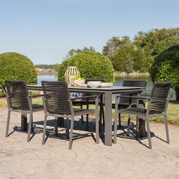 This complete 7-piece set combines modern design with exceptional durability. Features 6 stackable rope dining chairs and a 71" ceramic-top table built to withstand extreme temperatures and weather conditions.
