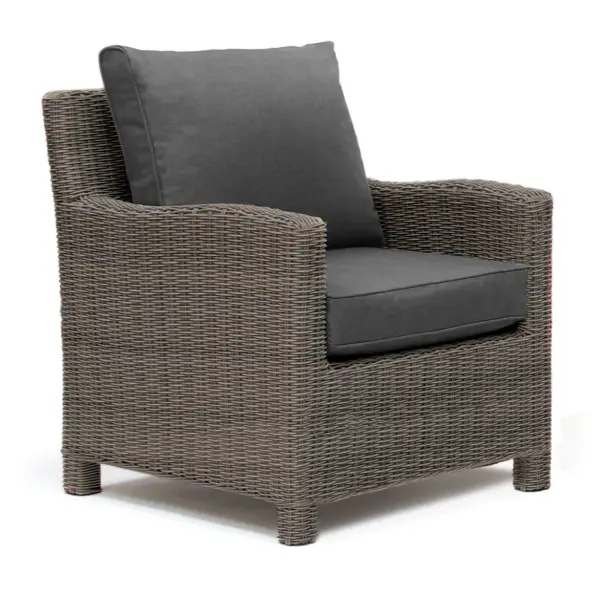 The Palma Wicker Lounge Chair combines handwoven weatherproof rattan with a powder-coated aluminum frame for durability. Features thick 4-inch Sunbrella cushions, UV-resistant construction rated for 2000 light hours, and integrated foot levelers for stability.