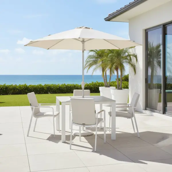Entertain in effortless style with the DIAMOND 5-Piece Dining Set, where modern elegance meets outdoor comfort. Smoothly rounded frames and FSC®-certified teak armrests bring a refined, natural warmth to your space, while the powder-coated aluminum frames and Sunbrella® padded sling seating ensure lasting durability and luxurious comfort. Fade-resistant and low-maintenance, this set lets you enjoy sophisticated outdoor dining with ease and grace. Powder-coated aluminum frame for long-lasting durability FSC®-certified teak armrests add warmth and natural detail Sunbrella® quick-drying padded sling seat and back for outdoor comfort Weather- and fade-resistant materials designed for outdoor use Ergonomic dining-height design with supportive seating Stackable chairs for convenient storage and space efficiency High-pressure laminate 3-layer, one-piece table top resists scratching & chipping Tabletop features an umbrella hole Protective, replaceable table foot glides prevent marring on any surface and extend the life of the table Ideal for residential and commercial outdoor settings Chair Colors: Matte White Frame w/ Natte Linen Fabric or Anthracite Frame w/ Canvas Soot Fabric Table Colors: Matte White w/ Light Rock Top or Anthracite w/ Anthracite Top