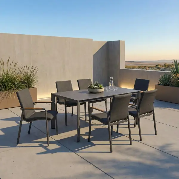 Entertain in effortless style with the DIAMOND 7-Piece Dining Set, where modern elegance meets outdoor comfort. Smoothly rounded frames and FSC®-certified teak armrests bring a refined, natural warmth to your space, while the powder-coated aluminum frames and Sunbrella® padded sling seating ensure lasting durability and luxurious comfort. Fade-resistant and low-maintenance, this set lets you enjoy sophisticated outdoor dining with ease and grace. Powder-coated aluminum frame for long-lasting durability FSC®-certified teak armrests add warmth and natural detail Sunbrella® quick-drying quick-drying padded sling seat and back for outdoor comfort Weather- and fade-resistant materials designed for outdoor use Ergonomic dining-height design with supportive seating Stackable chairs for convenient storage and space efficiency High-pressure laminate 3-layer, one-piece table top resists scratching & chipping Tabletop features an umbrella hole Protective, replaceable table foot glides prevent marring on any surface and extend the life of the table Ideal for residential and commercial outdoor settings Chair Colors: Matte White Frame w/ Natte Linen Fabric or Anthracite Frame w/ Canvas Soot Fabric Table Colors: Matte White w/ Light Rock Top or Anthracite w/ Anthracite Top - alternate view