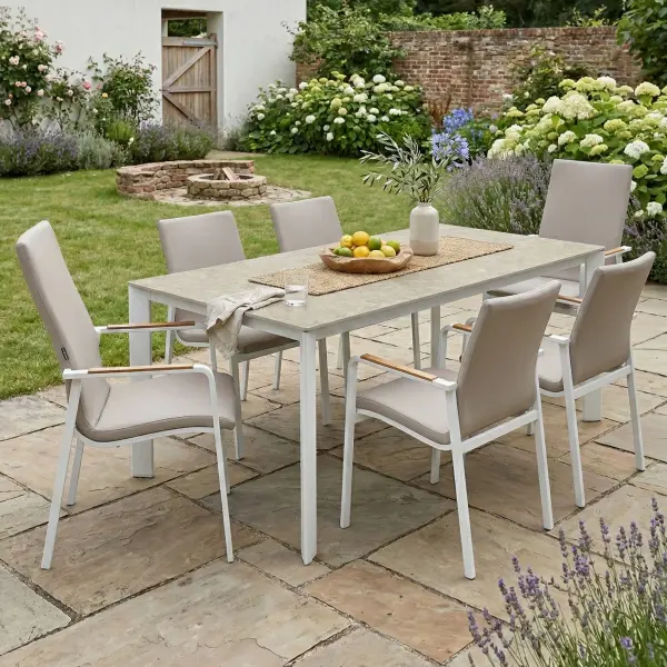 Entertain in effortless style with the DIAMOND 7-Piece Dining Set, including two high-back chairs and four mid-back dining height chairs. Smoothly rounded frames and FSC®-certified teak armrests bring a refined, natural warmth to your space, while the powder-coated aluminum frames and Sunbrella® padded sling seating ensure lasting durability and luxurious comfort. Fade-resistant and low-maintenance, this set lets you enjoy sophisticated outdoor dining with ease and grace. Powder-coated aluminum frame for long-lasting durability FSC®-certified teak armrests add warmth and natural detail Sunbrella® quick-drying padded sling seat and back for outdoor comfort Weather- and fade-resistant materials designed for outdoor use Ergonomic dining-height design with supportive seating Stackable chairs for convenient storage and space efficiency High-pressure laminate 3-layer, one-piece table top resists scratching & chipping Tabletop features an umbrella hole Protective, replaceable table foot glides prevent marring on any surface and extend the life of the table Ideal for residential and commercial outdoor settings Chair Colors: Matte White Frame w/ Natte Linen Fabric or Anthracite Frame w/ Canvas Soot Fabric Table Colors: Matte White w/ Light Rock Top or Anthracite w/ Anthracite Top