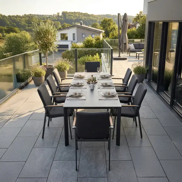 Entertain in effortless style with the DIAMOND 9-Piece High Back Dining Set. Smoothly rounded frames and FSC®-certified teak armrests bring a refined, natural warmth to your space, while the powder-coated aluminum frames and Sunbrella® padded sling seating ensure lasting durability and luxurious comfort. Fade-resistant and low-maintenance, this set lets you enjoy sophisticated outdoor dining with ease and grace. Powder-coated aluminum frame for long-lasting durability FSC®-certified teak armrests add warmth and natural detail Sunbrella® quick-drying padded sling seat and back for outdoor comfort Weather- and fade-resistant materials designed for outdoor use Ergonomic dining-height design with supportive seating Stackable chairs for convenient storage and space efficiency High-pressure laminate 3-layer, one-piece table top resists scratching & chipping Tabletop features an umbrella hole Protective, replaceable table foot glides prevent marring on any surface and extend the life of the table Ideal for residential and commercial outdoor settings Chair Color: Anthracite Frame w/ Canvas Soot Fabric Table Color: Anthracite w/ Anthracite Top Set Options: 9-Piece Mid-Back Chairs Dining Set Includes: (8) Mid-Back Dining Chairs ( 24”D x 23”W x 35”H) & (1) HPL Loft Table (87”D x 37”W x 29”H) 9-Piece High Back Chairs Dining Set Includes: (8) High Back Dining Chairs (24”D x 23”W x 39”H) & (1) HPL Loft Table (87”D x 37”W x 29”H) 9-Piece Mixed Chairs Dining Set Includes: (6) Mid-Back Dining Chairs (24”D x 23”W x 35”H), (2) High Back Dining Chairs (24”D x 23”W x 39”H) & (1) HPL Loft Table (87”D x 37”W x 29”H)