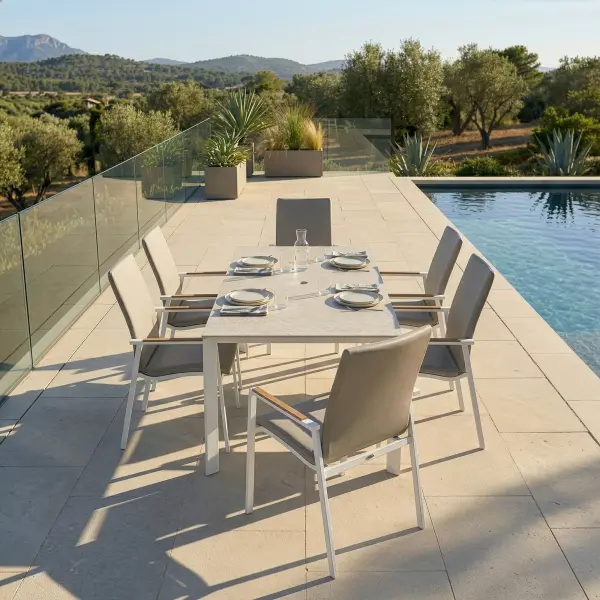 Entertain in effortless style with the DIAMOND 7-Piece High Back Dining Set. Smoothly rounded frames and FSC®-certified teak armrests bring a refined, natural warmth to your space, while the powder-coated aluminum frames and Sunbrella® padded sling seating ensure lasting durability and luxurious comfort. Fade-resistant and low-maintenance, this set lets you enjoy sophisticated outdoor dining with ease and grace. Powder-coated aluminum frame for long-lasting durability FSC®-certified teak armrests add warmth and natural detail Sunbrella® quick-drying padded sling seat and back for outdoor comfort Weather- and fade-resistant materials designed for outdoor use Ergonomic dining-height design with supportive seating Stackable chairs for convenient storage and space efficiency High-pressure laminate 3-layer, one-piece table top resists scratching & chipping Tabletop features an umbrella hole Protective, replaceable table foot glides prevent marring on any surface and extend the life of the table Ideal for residential and commercial outdoor settings Chair Colors: Matte White Frame w/ Natte Linen Fabric or Anthracite Frame w/ Canvas Soot Fabric Table Colors: Matte White w/ Light Rock Top or Anthracite w/ Anthracite Top