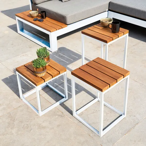 Add more functional dining and entertaining space with the Gili aluminum and FSC Certified teak coffee table and side tables. This versatile collection can accommodate any outdoor space from an intimate balcony area to a more spacious patio or deck. Sturdy Brazilian FSC-certified components Robust teak adds elegance as well as stability Light-weight powder-coated aluminum construction with stainless steel hardware Frame features full circumference welds for added strength Durable, all-weather frame construction Frame Color: White Top Color: Robust Teak