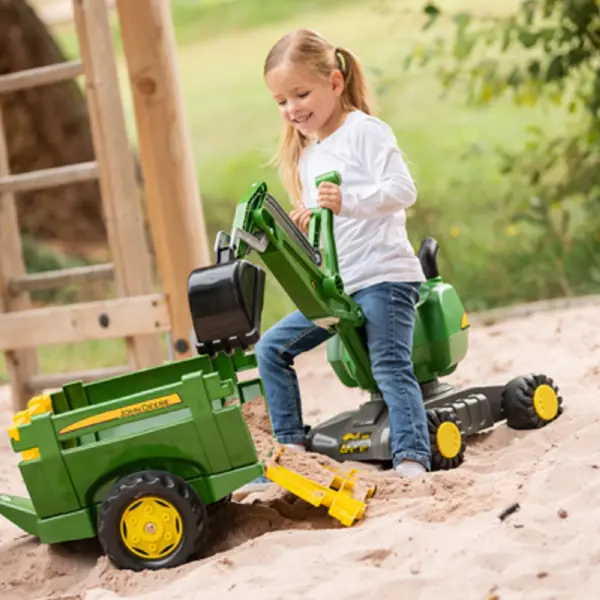 This German-made farm trailer attaches to Rolly tractors, featuring removable sides, a lowering rear gate, and high-impact resin construction. Perfect for outdoor imaginative play with easy dump functionality. - alternate view