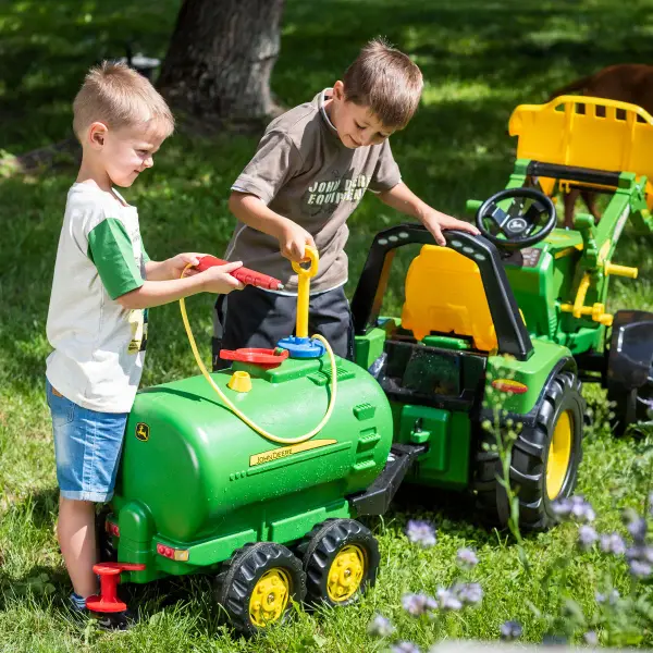 The rollyTanker John Deere is the perfect toy for children ages 3 to 10 who dream of big farming adventures. This sturdy tank trailer is specially designed for young farmers and offers hours of fun and creative play. With its sturdy construction and two axles, the rollyTanker John Deere is ready to transport everything young farmers need. But that's not all – this tank trailer features an integrated water pump with a sprayer, allowing children to work like real farmers. They can pump water from the trailer's 30-liter tank and spray it with the hand sprayer or drain it exactly where they need it with the spout. The ability to fill the tank with water makes this toy particularly interactive and educational. Children can learn how important water is for farming while developing their fine motor skills and imagination while playing. The rollyTanker John Deere is not just a toy, but also an educational tool that stimulates children's imaginations and introduces them to basic farming concepts. Let your little farmers experience the joy of play and discovery with this awesome tank trailer. High impact blow molded resin body Double axle wheels allows the Tanker for free standing Removable Pump with Spray Nozzle Rear tap water spreader Holds up to 7 gallons of liquid Made in Germany View Product Manual - alternate view
