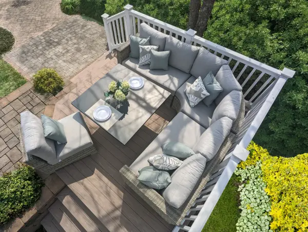 The Aya 5-piece corner set combines exceptional comfort with remarkable versatility. Hand-woven all-weather wicker over aluminum frames creates a durable, stylish outdoor living space. The adjustable-height table transforms from coffee to dining height. - alternate view