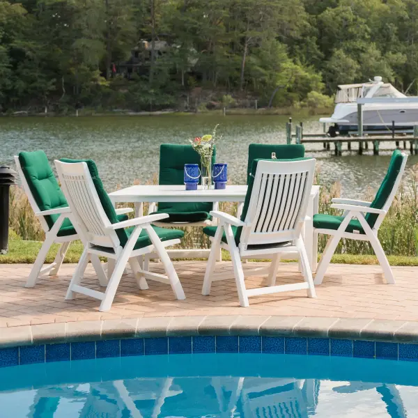 Premium 7-piece resin dining set featuring German craftsmanship with rust-proof, rot-resistant construction. Includes 4-position reclining chairs with Sunbrella cushions and scratch-resistant KETTALUX Plus table top.