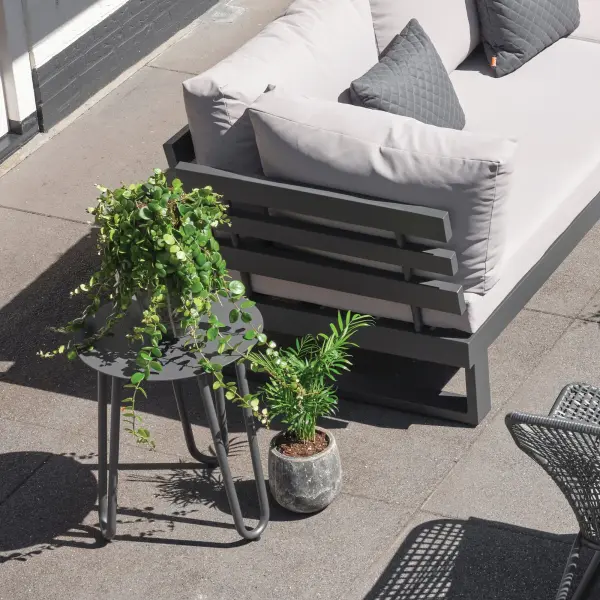 The Blixum Side Table combines lightweight aluminum construction with durable powder-coated finish, making it perfect for patios and indoor spaces. Full circumference welds ensure strength while protective foot glides prevent surface damage. - alternate view