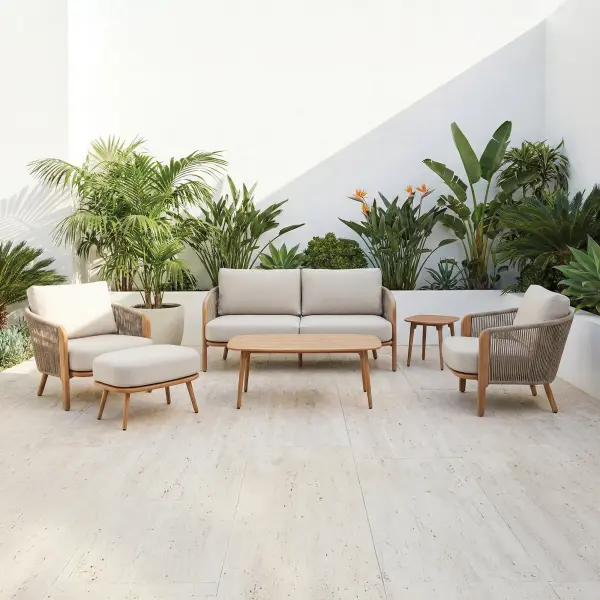 The Chelsea Lounge Set creates a warm, inviting space to relax in style, blending the natural look of wood with worry-free durability. Soft, plush cushions in a calming Point Dune tone and textured Sandy Tweed rope add comfort you’ll want to sink into, day after day. Designed for effortless outdoor living, it delivers a refined, modern feel at a price that makes upgrading your space easy. Durable aluminum frame w/ Therma-Luxe heat transfer finish Wood grain look imitating natural wood without the maintenance 100% solution dyed acrylic fabric and olefin rope Plush seat and back cushions for ultimate comfort Ships in one box with minimum assembly Modern upscale look for a fraction of the cost Cushion color: Point Dune Rope color: Sandy Tweed Frame color: Honey Oak Lounge Set Includes: (2) Lounge Chairs (1) Loveseat (1) Coffee Table (1) Side Table (1) Ottoman *Optional*