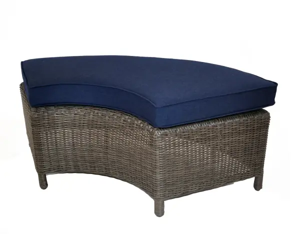 The Palma Wicker Curved Bench offers a unique fusion of dining and lounge seating with handwoven weatherproof wicker, powder-coated aluminum frame, and plush 4-inch Sunbrella cushions for all-weather durability and comfort.