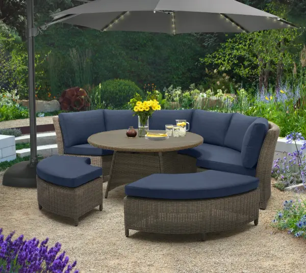 The Palma 5-piece set combines handwoven weatherproof wicker with powder-coated aluminum frames for lasting outdoor elegance. Features a 51" round dining table with eco-friendly tabletop and plush Sunbrella cushions.